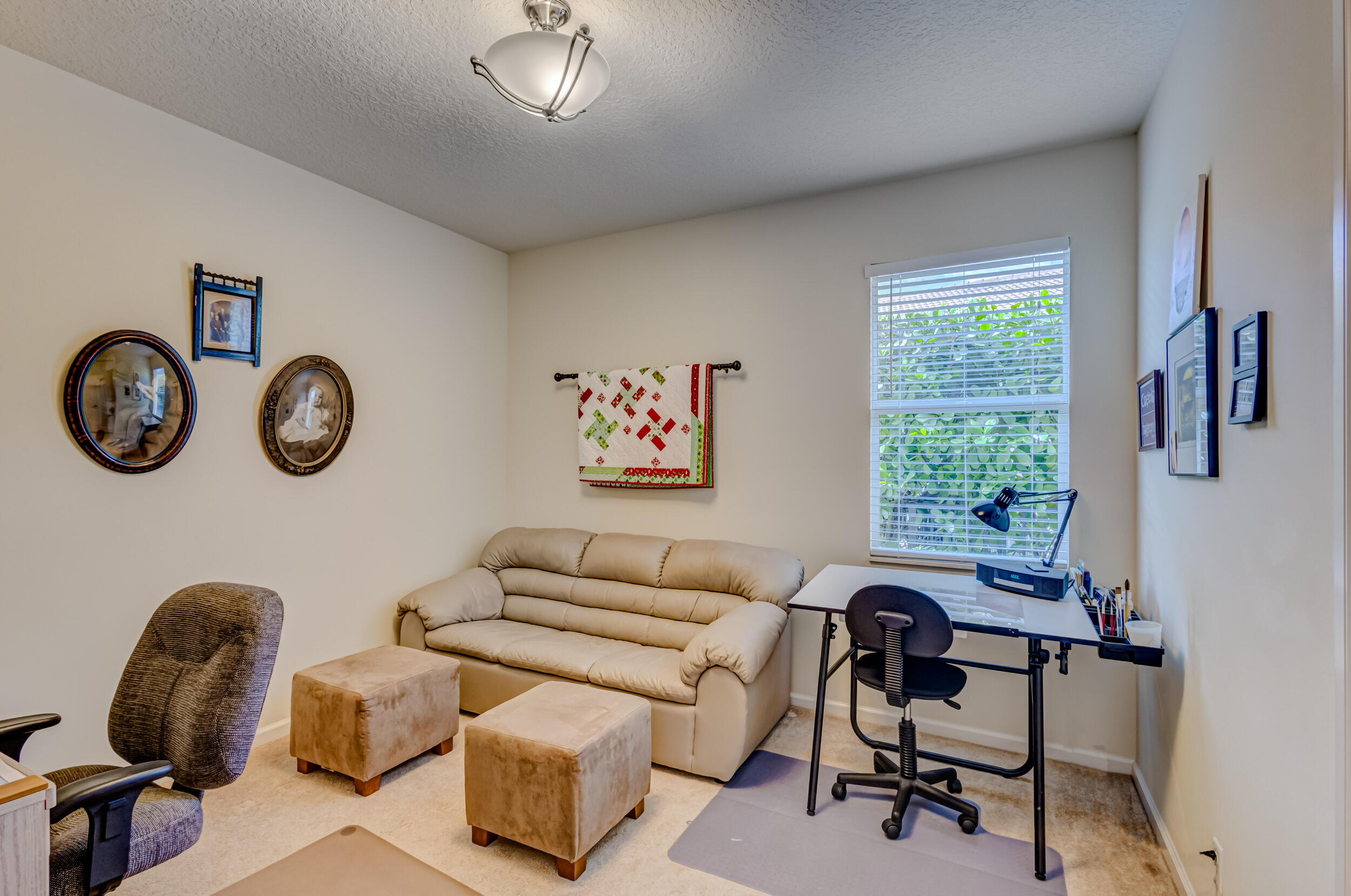 237 Carina Drive Jupiter, FL 33478 - Photo 45 of 73 a living room with furniture and a window