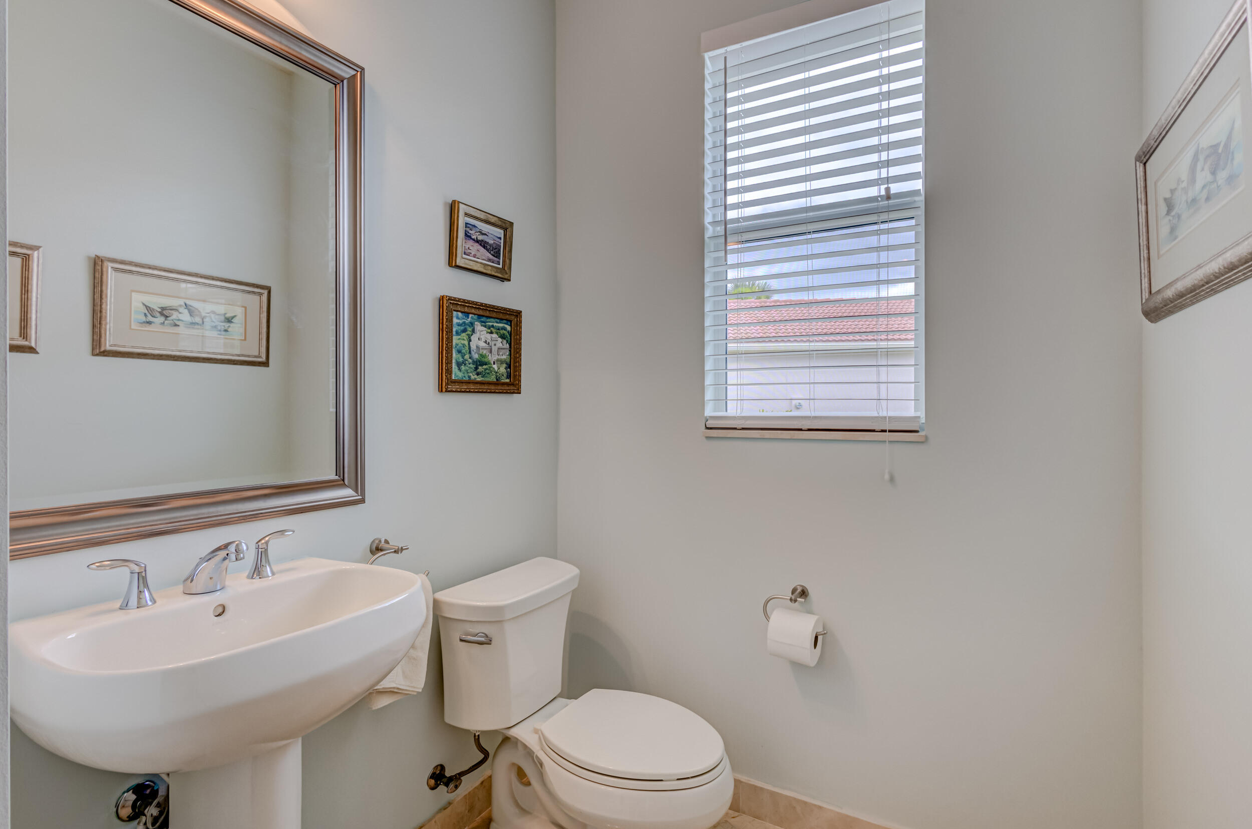 237 Carina Drive Jupiter, FL 33478 - Photo 54 of 73 a bathroom with a sink mirror and toilet