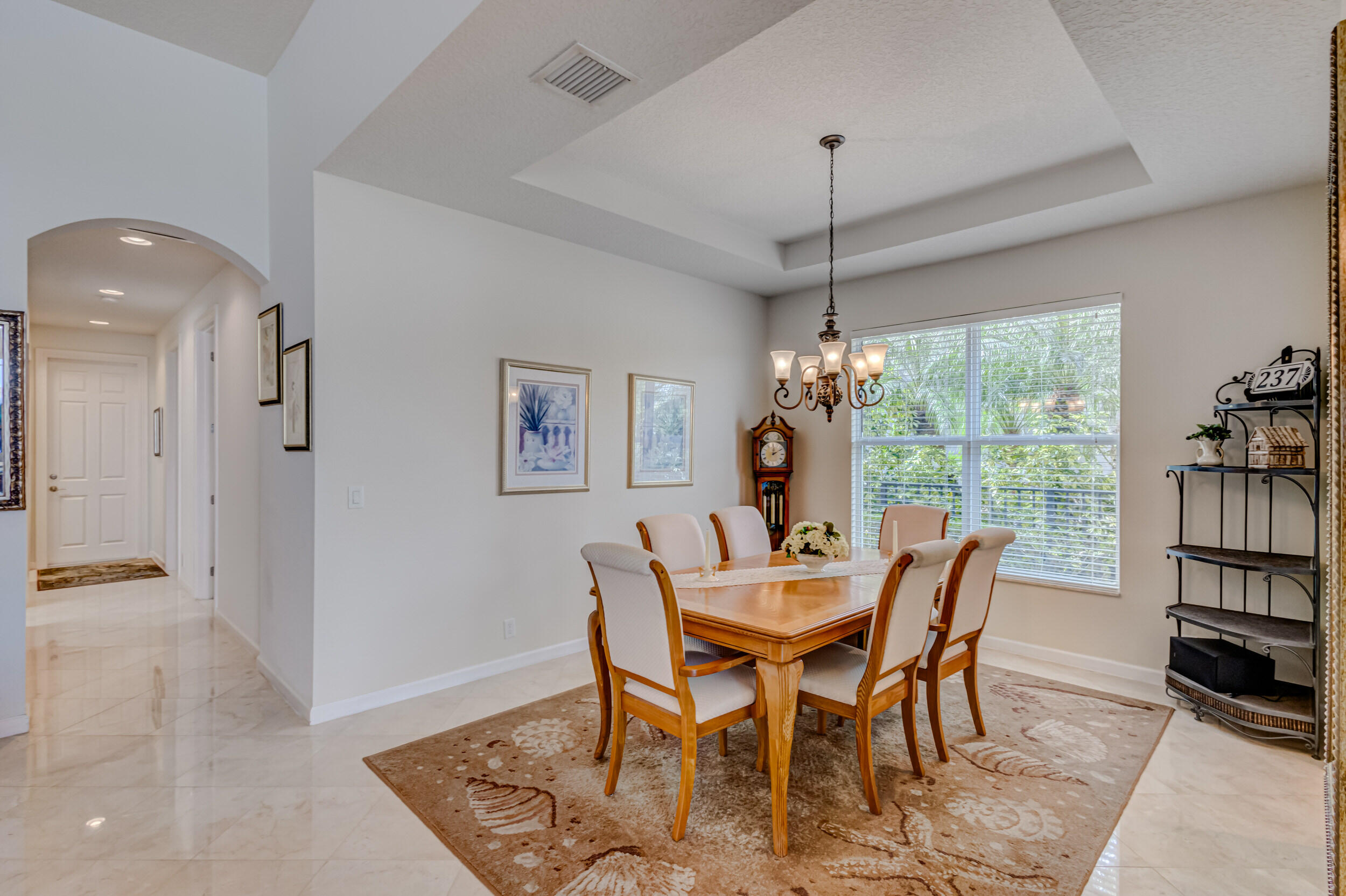 237 Carina Drive Jupiter, FL 33478 - Photo 57 of 73 a view of a dining room with furniture window and outside view