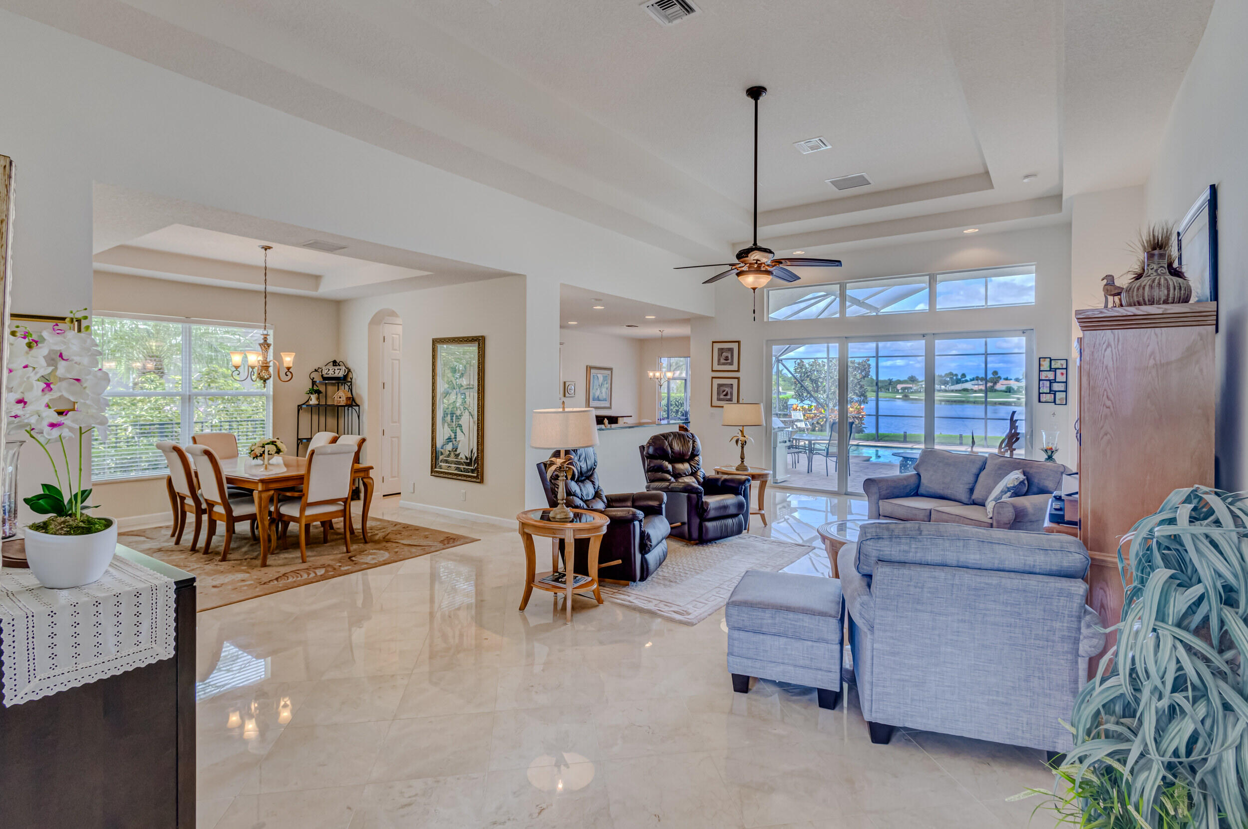 237 Carina Drive Jupiter, FL 33478 - Photo 69 of 73 a living room with furniture and large windows