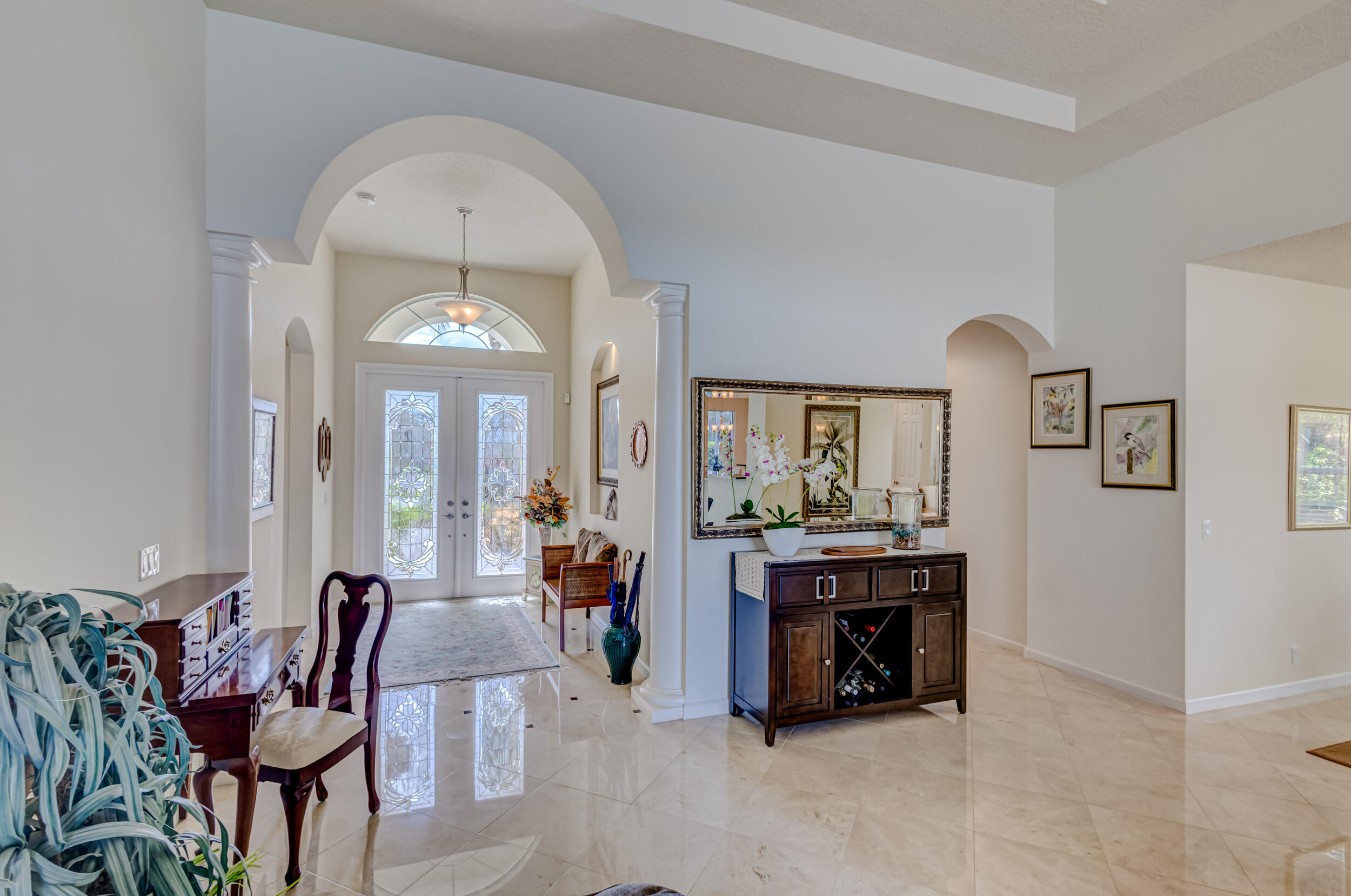 237 Carina Drive Jupiter, FL 33478 - Photo 70 of 73 a view of a dining room with furniture window and outside view