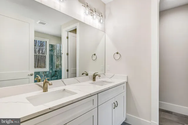 a bathroom with a bathtub and shower