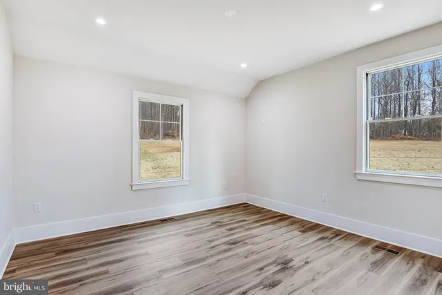 a bathroom with a shower sink and mirror