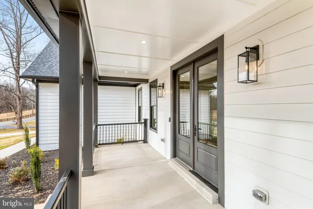 a view of a livingroom with wooden floor and a window
