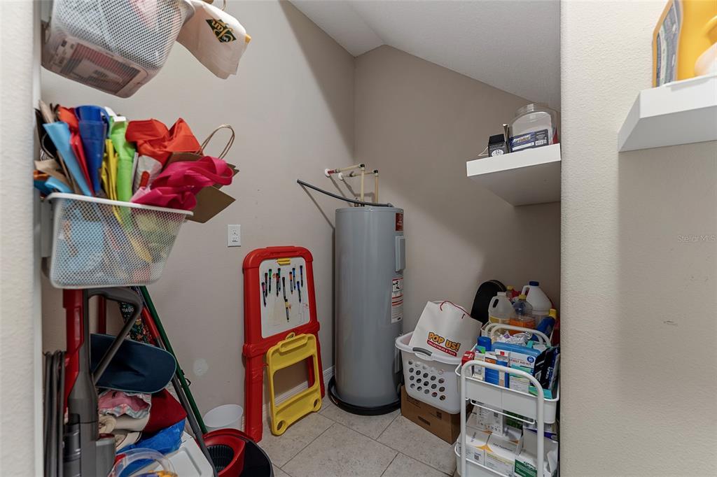 3523 Clay Brick Road St. Cloud, FL 34773 - Photo 19 of 62 a view of walk in closet with clothes and shoes