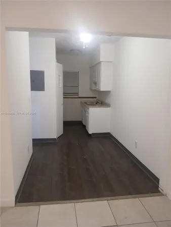 a room with cabinets and dust bin