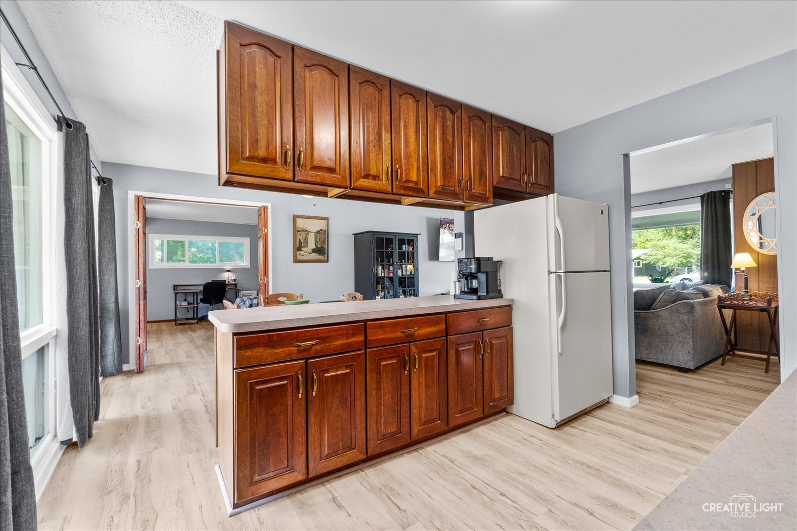 4 Woodcliff Road Montgomery, IL 60538 - Photo 7 of 18 a kitchen with stainless steel appliances granite countertop a refrigerator a stove a sink dishwasher and wooden cabinets with wooden floor