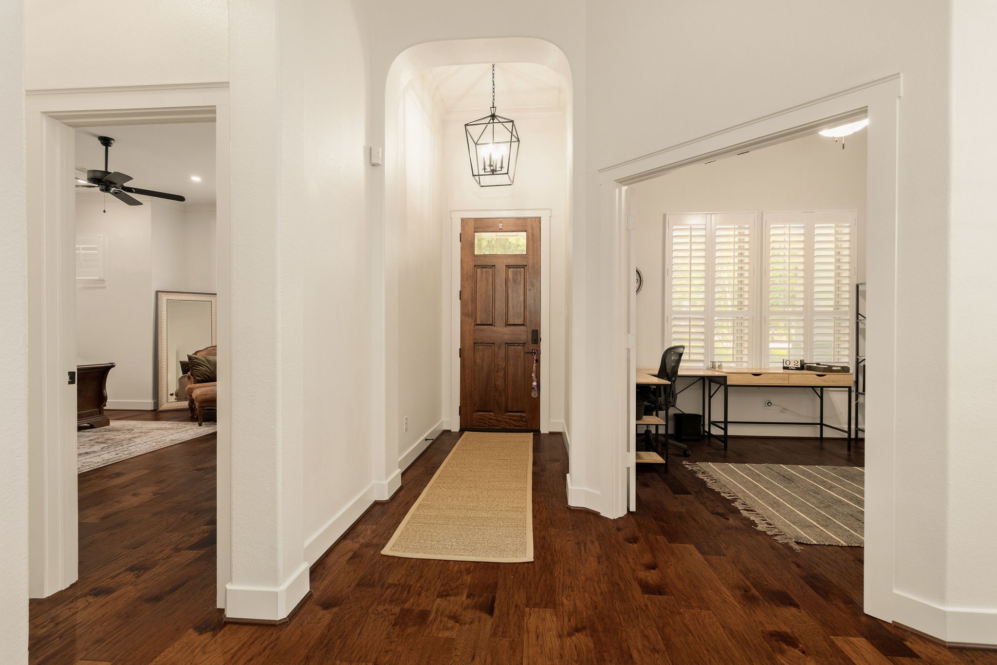 16650 Seminole Ridge Drive Cypress, TX 77433 - Photo 16 of 27 a view of a hallway with wooden floor windows and livingroom