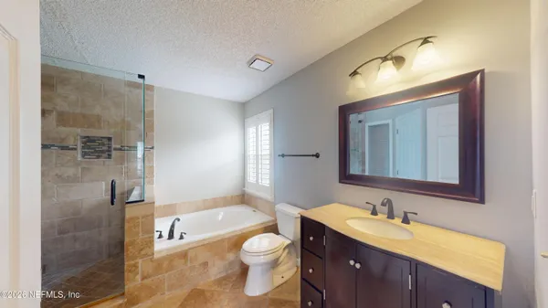 a bathroom with a bathtub and shower