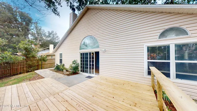 a view of balcony with two large trees