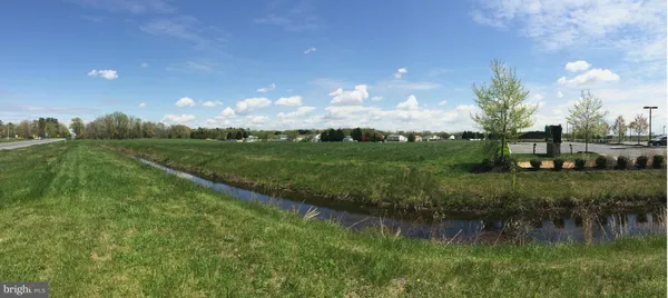 a view of a lake with green space