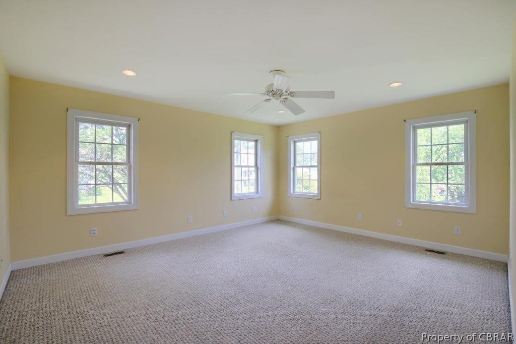 2069 Jenkins Neck Road Hayes, VA 23072 - Photo 19 of 42 First Floor Primary Bedroom Suite