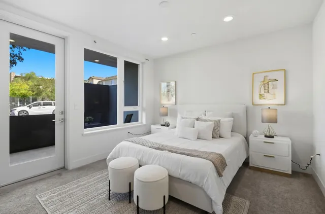 a bedroom with a bed and a couch