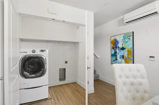 a view of hallway with washer and dryer