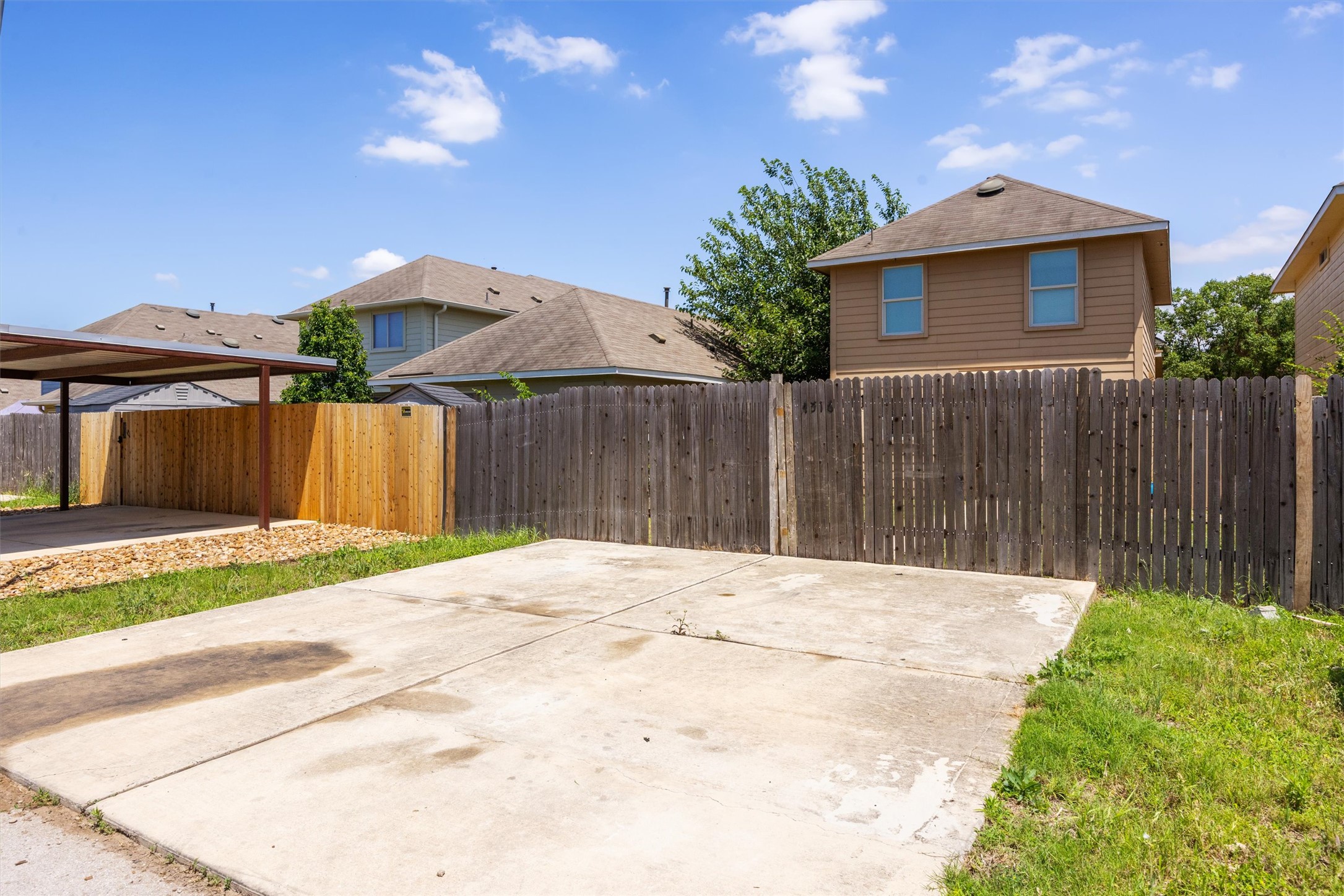 4516 Kind Way, Unit 253 Austin, TX 78725 - Photo 30 of 31 a front view of a house with a yard