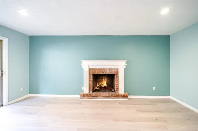 a view of a livingroom with a fireplace