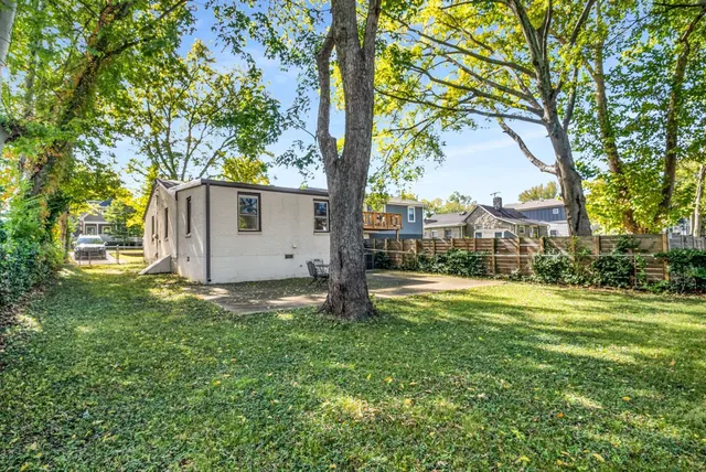a backyard of a house with lots of green space