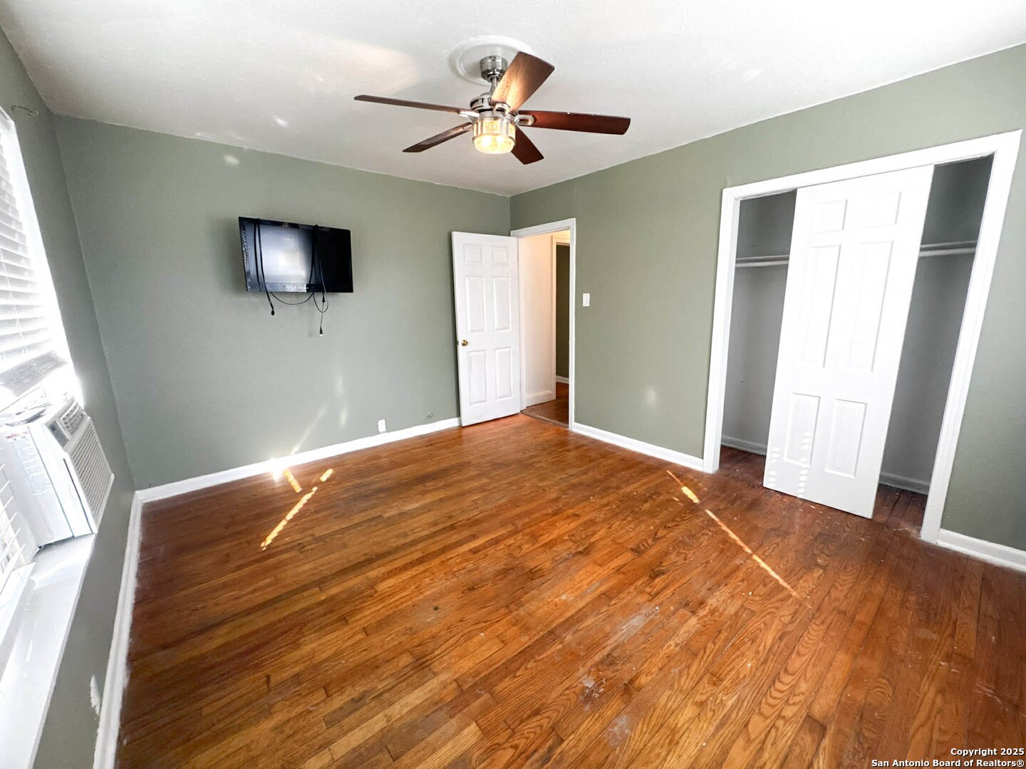 520 West Pyron Avenue San Antonio, TX 78214 - Photo 12 of 19 a bedroom with a bed and a flat screen tv