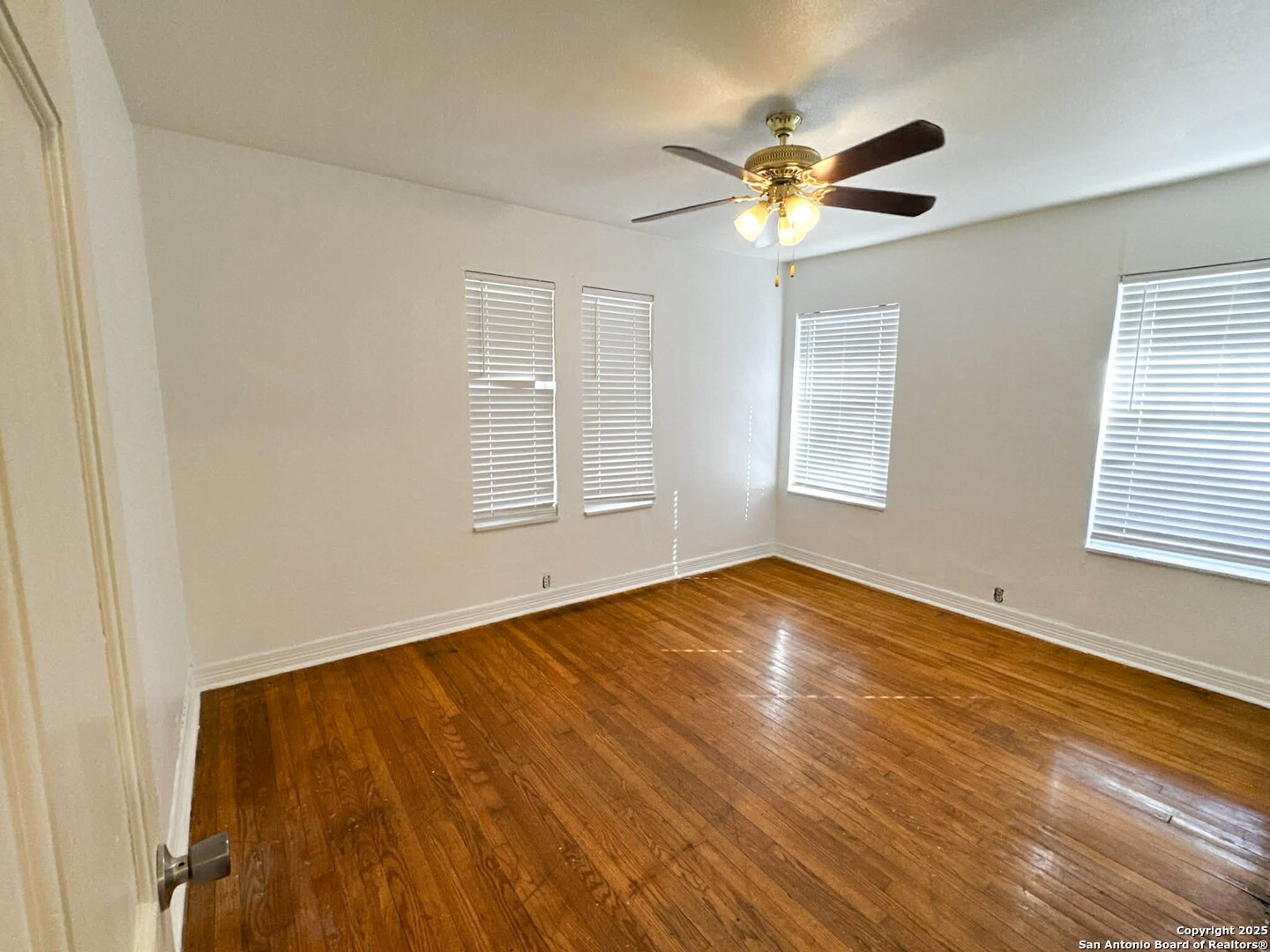 520 West Pyron Avenue San Antonio, TX 78214 - Photo 15 of 19 a view of empty room with wooden floor and fan
