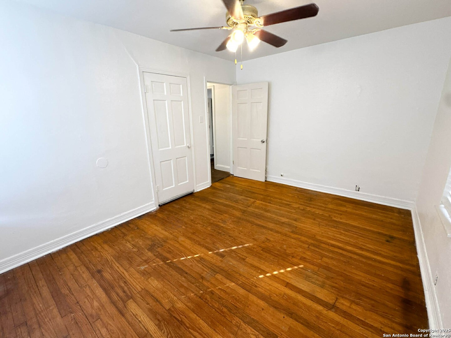 520 West Pyron Avenue San Antonio, TX 78214 - Photo 16 of 19 an empty room with wooden floor closet and fan