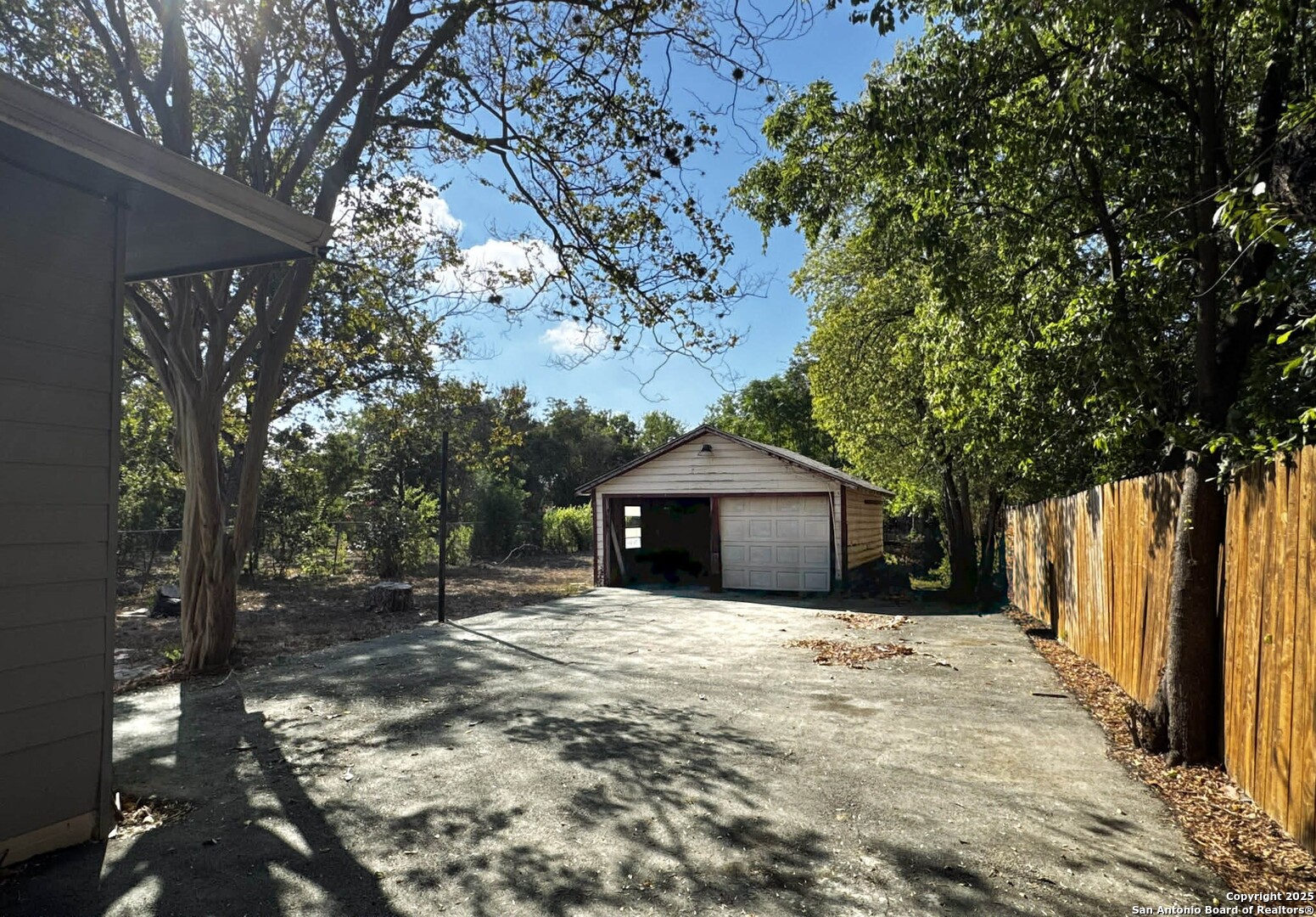 520 West Pyron Avenue San Antonio, TX 78214 - Photo 17 of 19 a front view of a house with a yard and garage