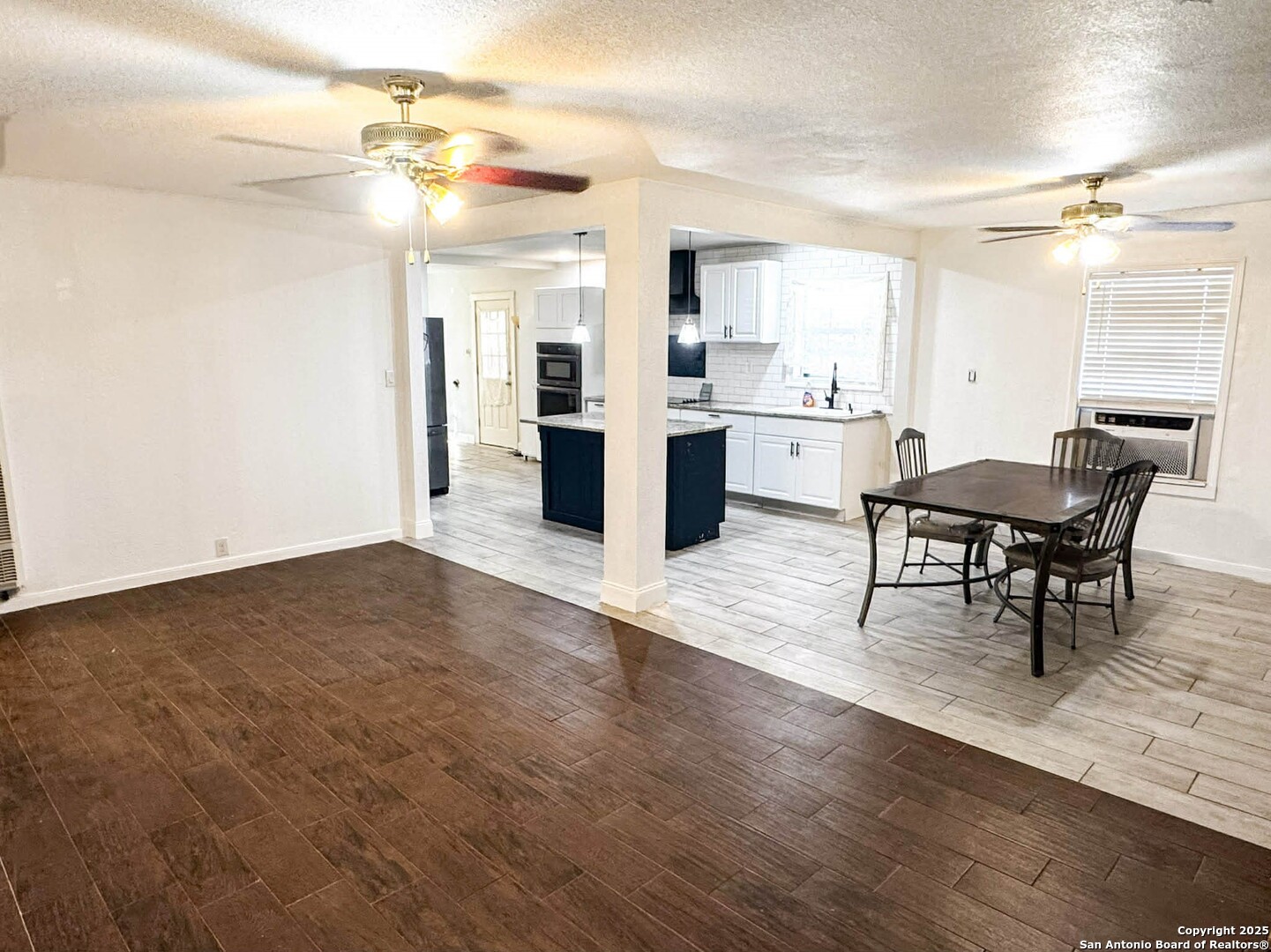 520 West Pyron Avenue San Antonio, TX 78214 - Photo 5 of 19 a view of kitchen and dining room with wooden floor