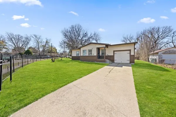 a house with garden in front of it