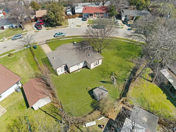 an aerial view of residential houses with outdoor space
