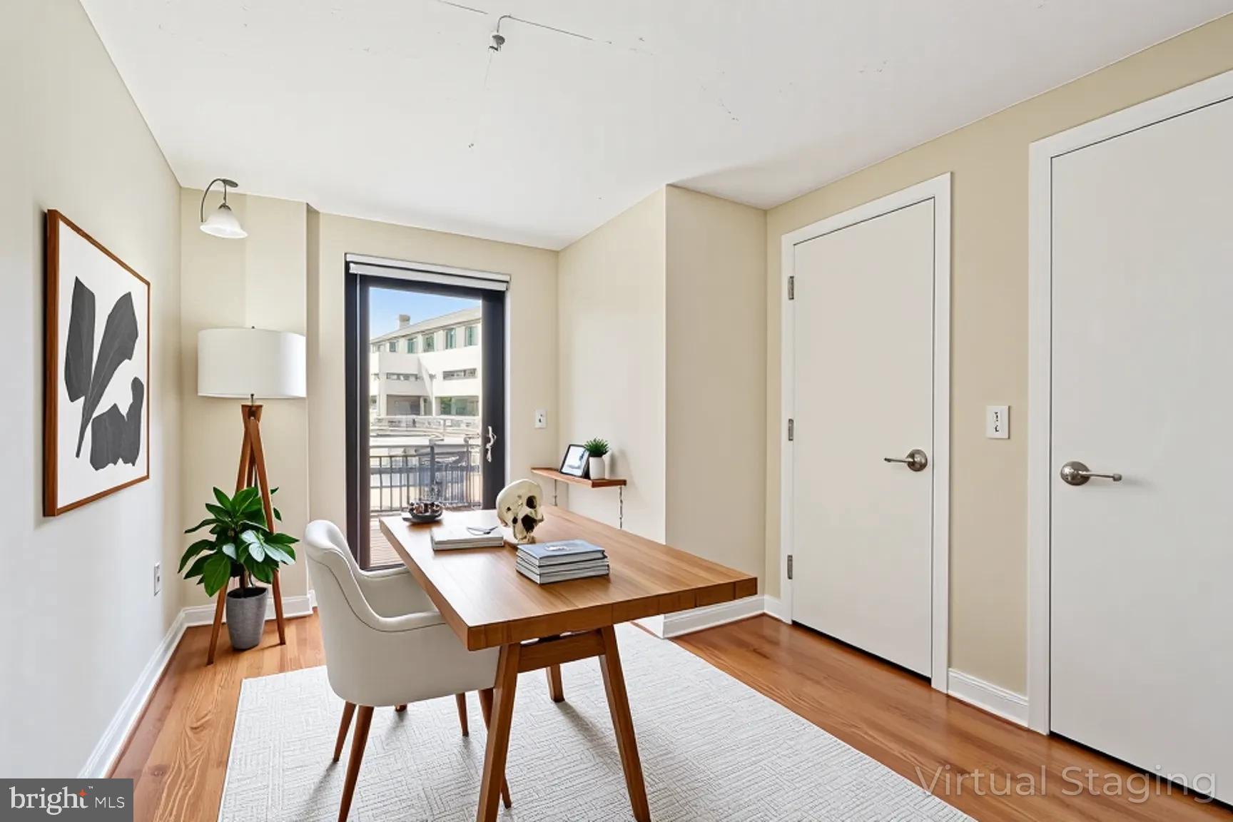 2120 Vermont Avenue Northwest, Unit 620 Washington, DC 20001 - Photo 12 of 69 a view of a workspace with furniture and window