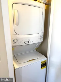 a view of an livingroom with furniture and window