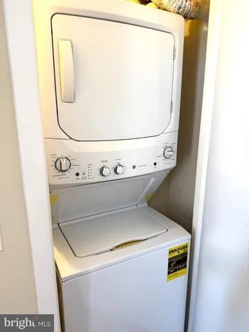 a view of an livingroom with furniture and window