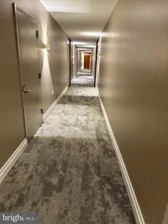 a glass building with a sign board