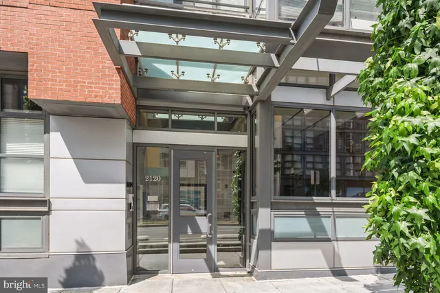 a front view of a building with street view