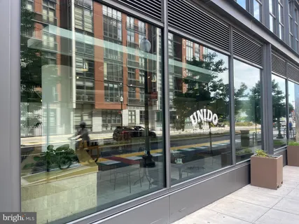 a view of a swimming pool with outdoor seating