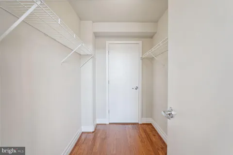 a bathroom with a granite countertop sink mirror toilet and bathtub