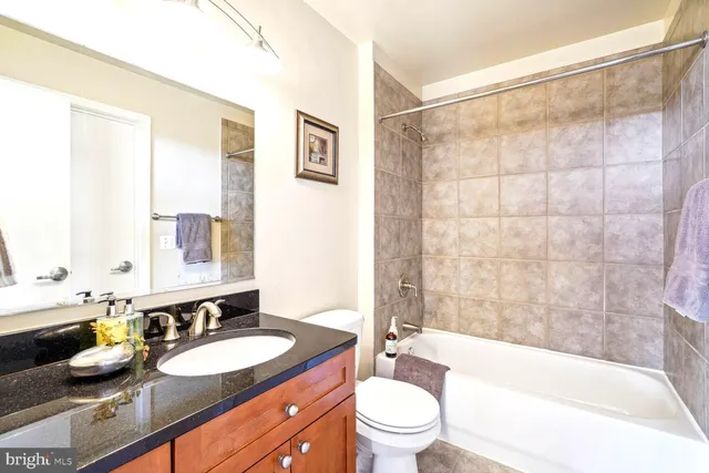 a view of a workspace with furniture and window