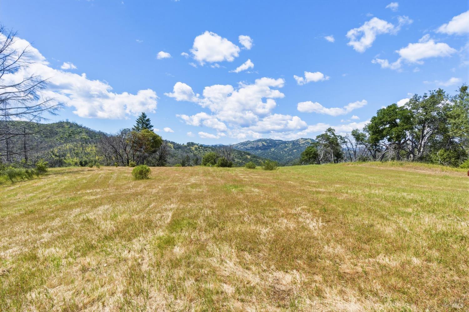 3444 Chicken Ridge Road Healdsburg, CA 95448 - Photo 19 of 21 a view of a lake and sunset