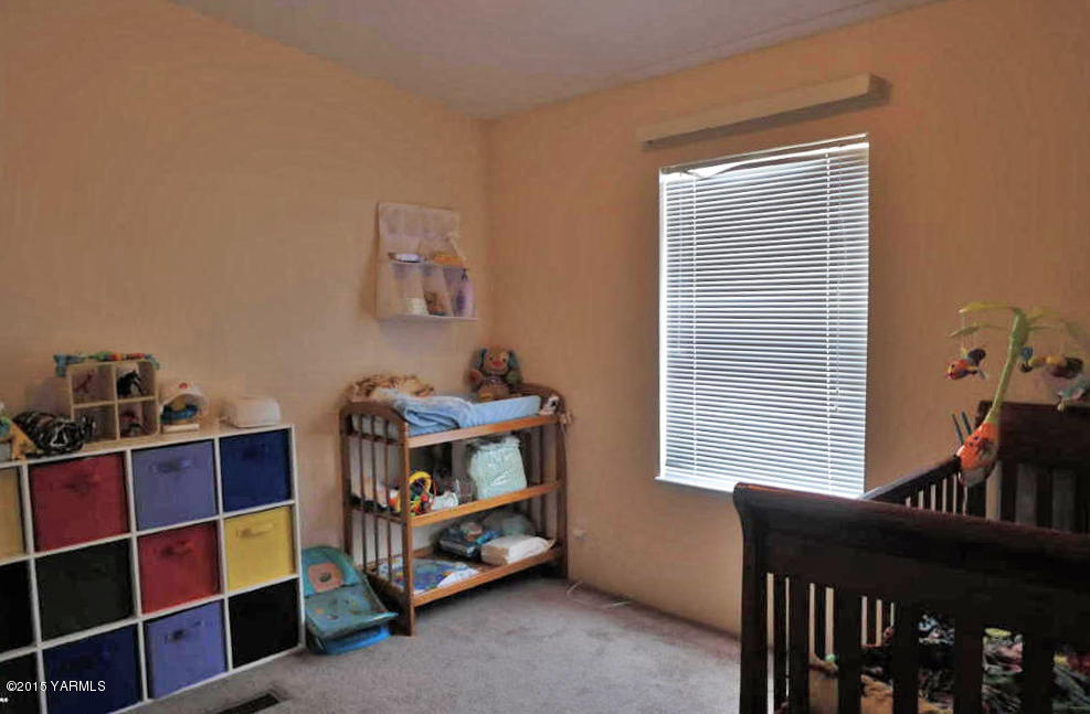 2013 Outlook Road Outlook, WA 98938 - Photo 11 of 18 a room with furniture and a window