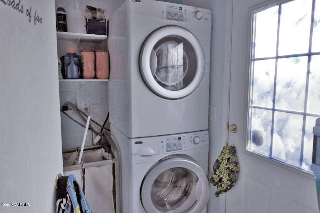 2013 Outlook Road Outlook, WA 98938 - Photo 17 of 18 a view of a hallway with washer and dryer