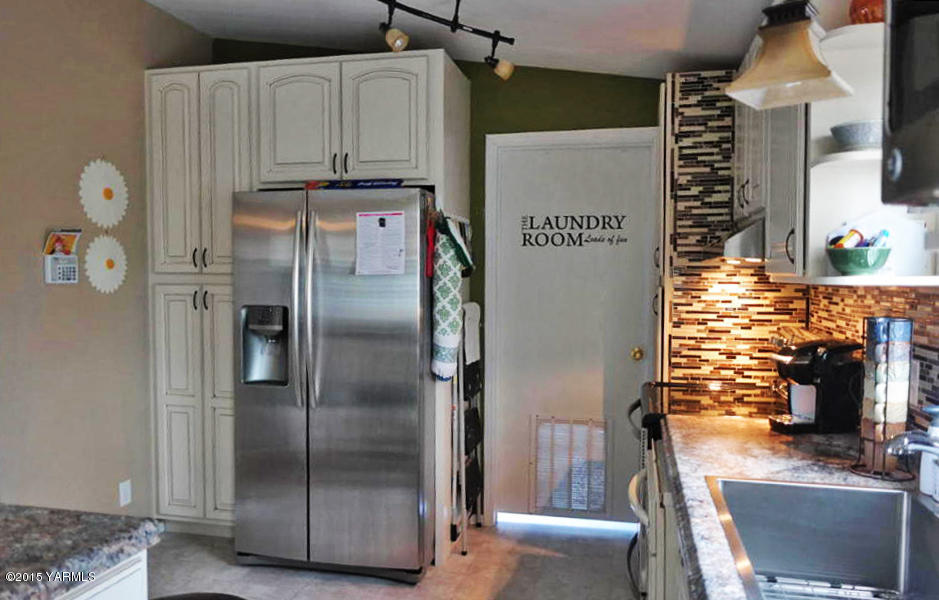 2013 Outlook Road Outlook, WA 98938 - Photo 6 of 18 a kitchen with stainless steel appliances granite countertop a refrigerator and a stove