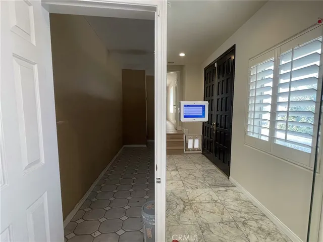 a kitchen with white cabinets and a sink