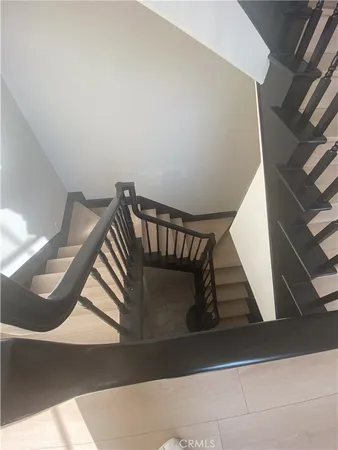 a kitchen with granite countertop a refrigerator and a sink