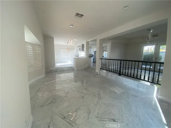 a kitchen with stainless steel appliances a refrigerator sink and microwave
