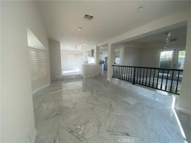 a kitchen with stainless steel appliances a refrigerator sink and microwave