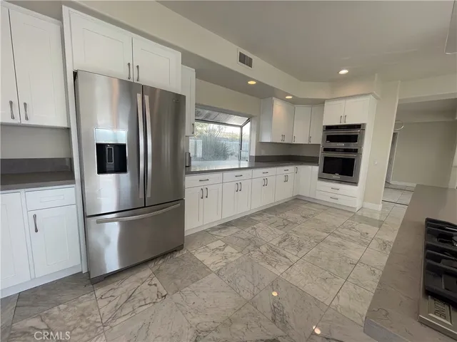 a view of entryway livingroom and hall with wooden floor