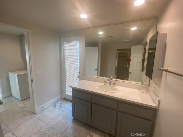 a view of a swimming pool with an outdoor space and seating area