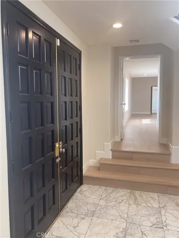 a view of wooden floor and windows in an empty room