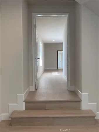 an empty room with closet and a window