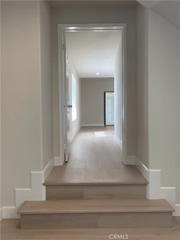 an empty room with closet and a window