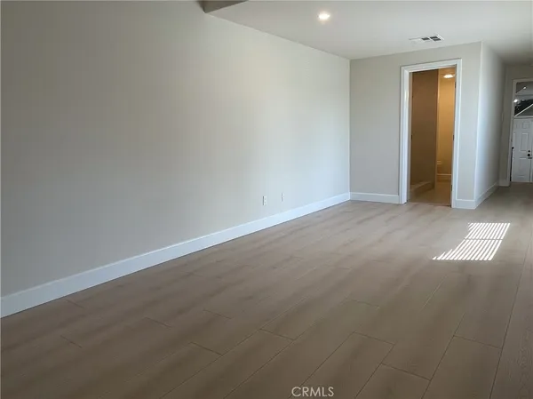 a white toilet sitting next to a sink